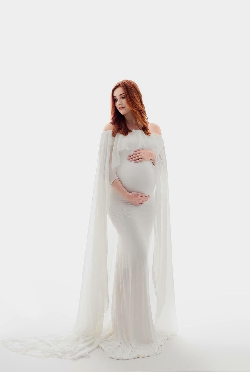 Pregnant mother in the Isolde Gown in Ivory by Sew Trendy Accessories in the studio.