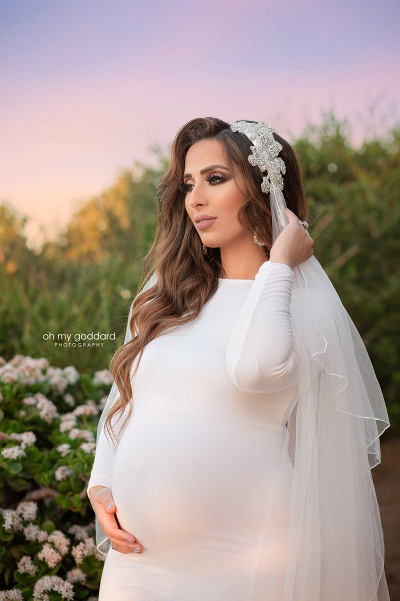 Beautiful pregnant woman wearing the Ravenna bridal mesh cape over her Sew Trendy gown in White