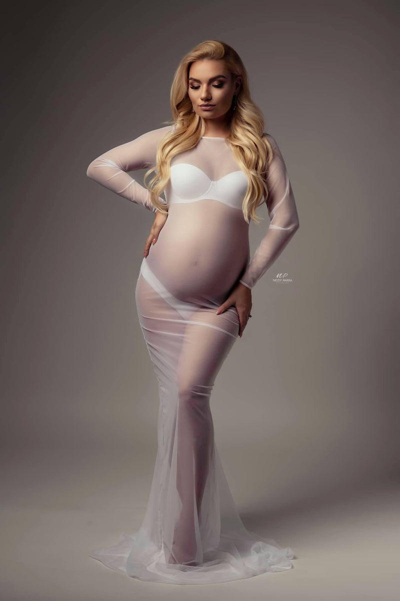 Stunning pregnant woman in sheer white maternity dress by Sew Trendy