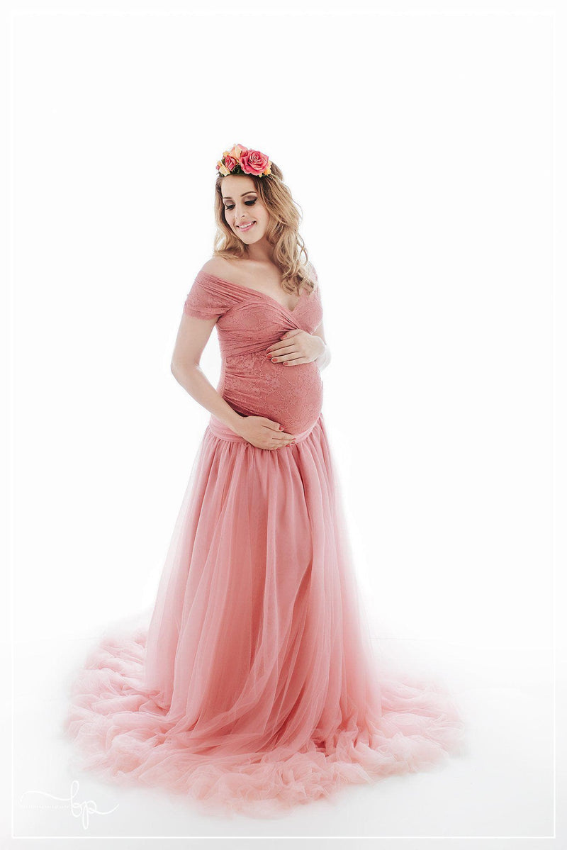 Beautiful pregnant woman wearing the Willow skirt by Sew Trendy standing in backlit studio.