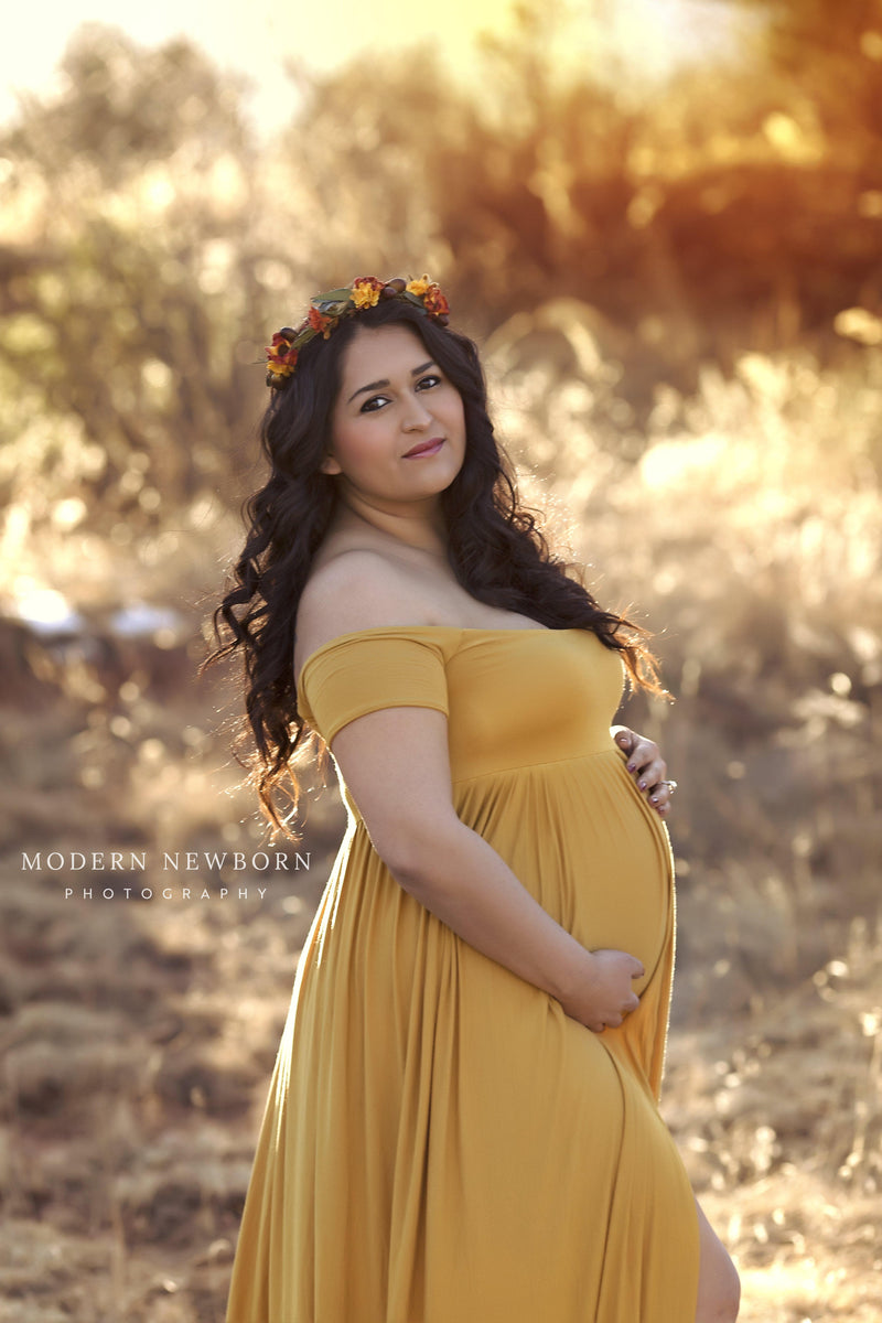 Pregnant mother in the Kelly Gown by Sew Trendy Accessories in Gold with a flower crown.