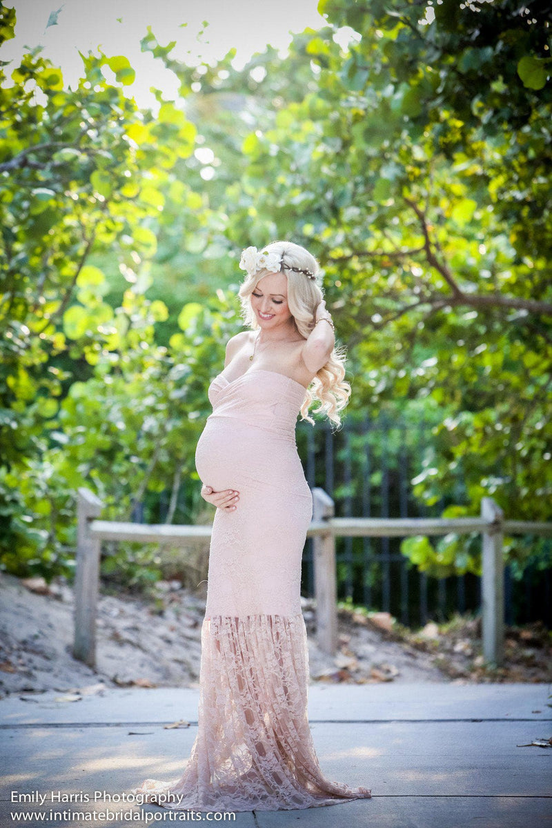 Pregnant mother in the Marilyn Gown in Blush by Sew Trendy Accessories with trees in the background.