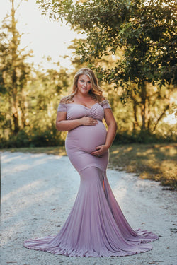 Beautiful expecting mother wearing the Allysa gown in mauve by Sew Trendy standing on forrest path