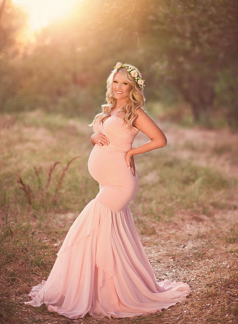 Pregnant mother in the Liv Gown by Sew Trendy Accessories in Ivory standing  on forrest path 