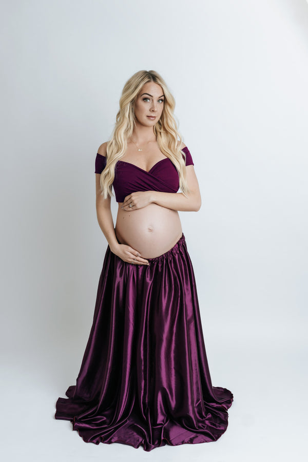 Beautiful blonde pregnant woman wearing the Adelia skirt by Sew Trendy standing in backlit studio