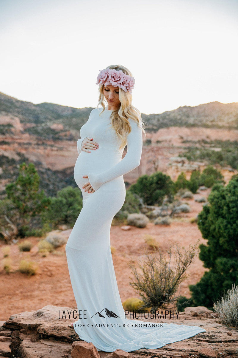 Pregnant mother in the Krysten Gown by Sew Trendy Accessories in White with a flower crown.