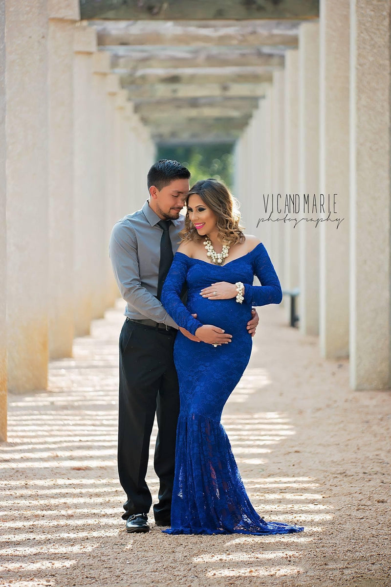 Pregnant woman in the Priscilla Gown in Royal Blue by Sew Trendy Accessories posing with a man.