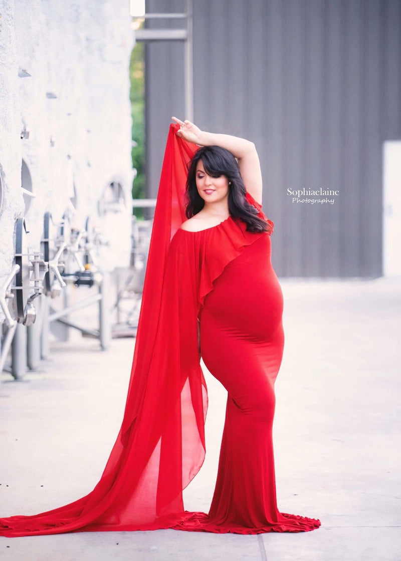 Pregnant mother in the Isolde Gown by Sew Trendy Accessories in Red downtown.