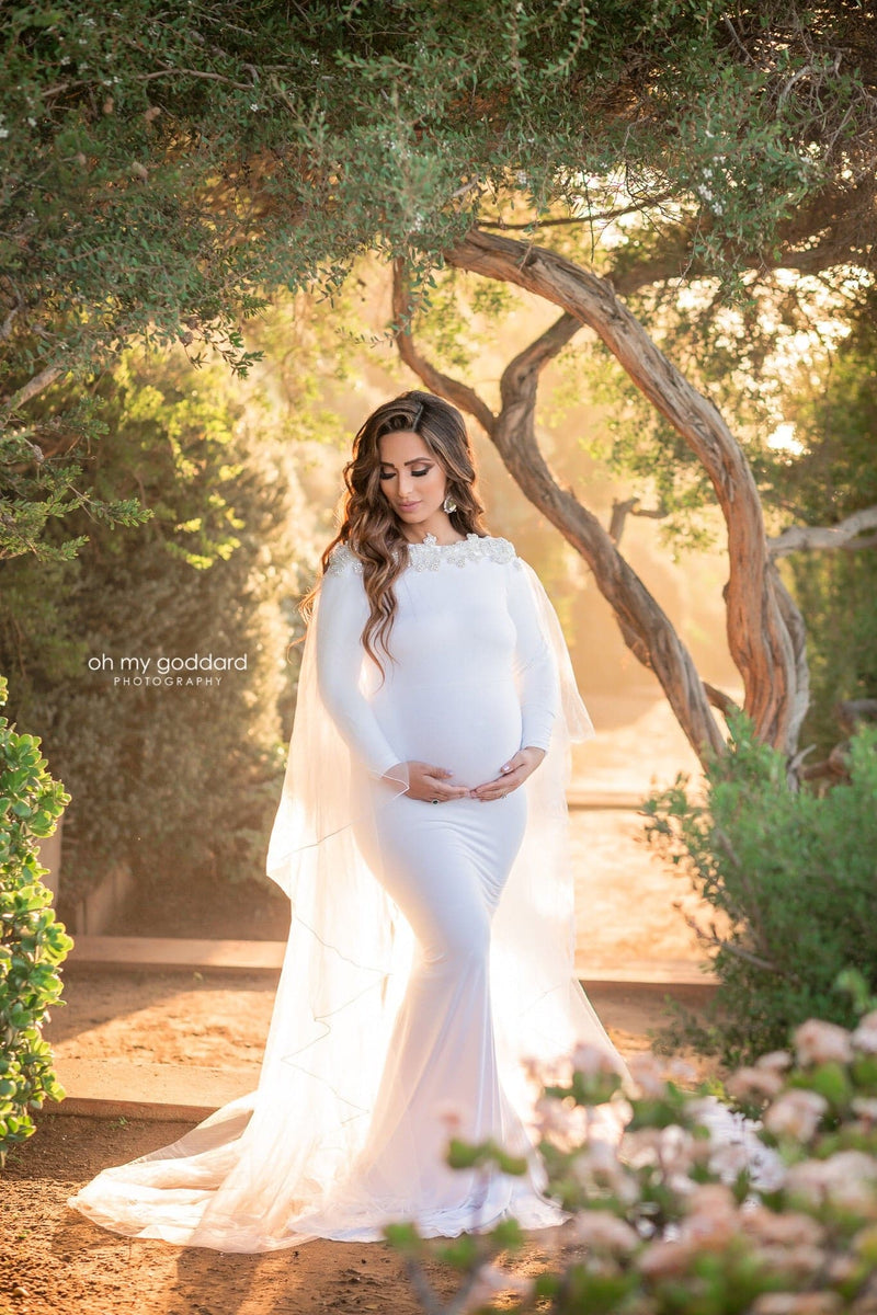 Beautiful pregnant woman wearing the Ravenna bridal mesh cape over her Sew Trendy gown in White
