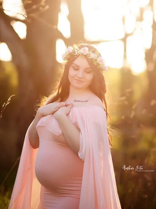 Pregnant mother in the Isolde Gown in Blush by Sew Trendy Accessories with a flower crown.