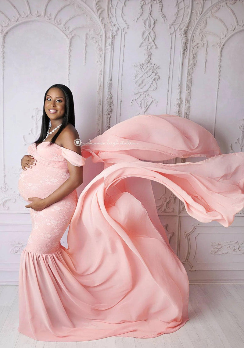 Expecting mother wearing the Amorah gown in dusty pink by Sew Trendy in studio.