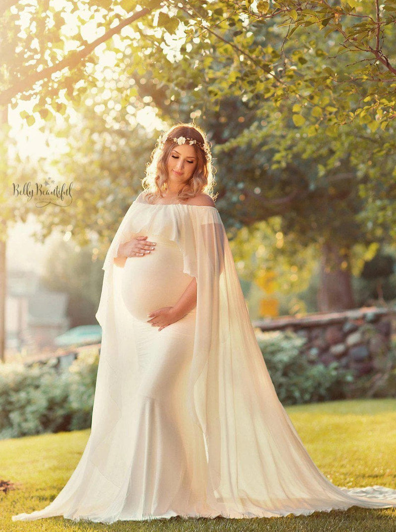 Pregnant mother in the Isolde Gown by Sew Trendy Accessories in Ivory with a flower crown.