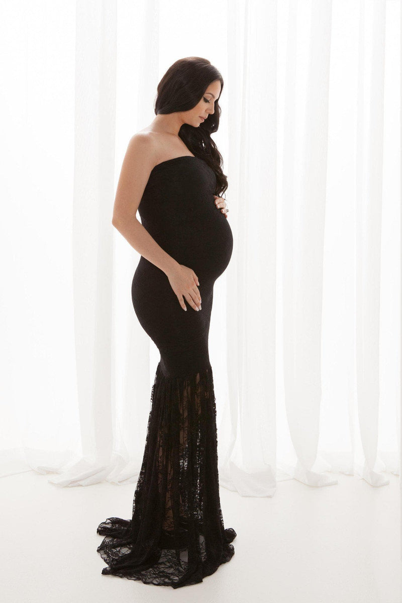 Pregnant mother in the Marilyn Gown in Black by Sew Trendy Accessories in the studio with a white background.